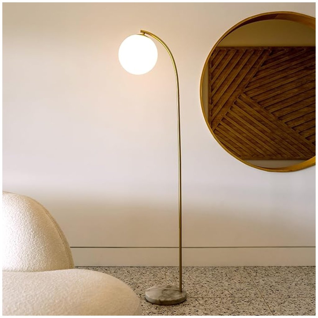 Brightech Luna Drop LED Floor Lamp, arcing mid-century modern standing lamp with frosted glass globe and brass finish, perfect for stylish interiors.