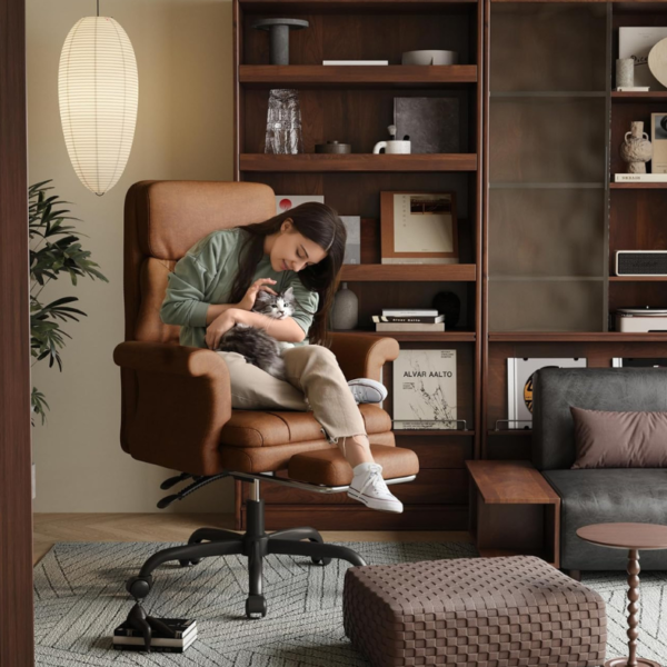 woman holding cat sitting in ergonomic office chair
