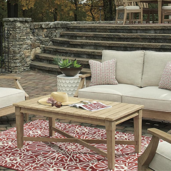 Luxe backyard showing furniture pieces with rug