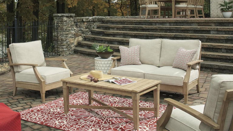 Luxe backyard showing furniture pieces with rug