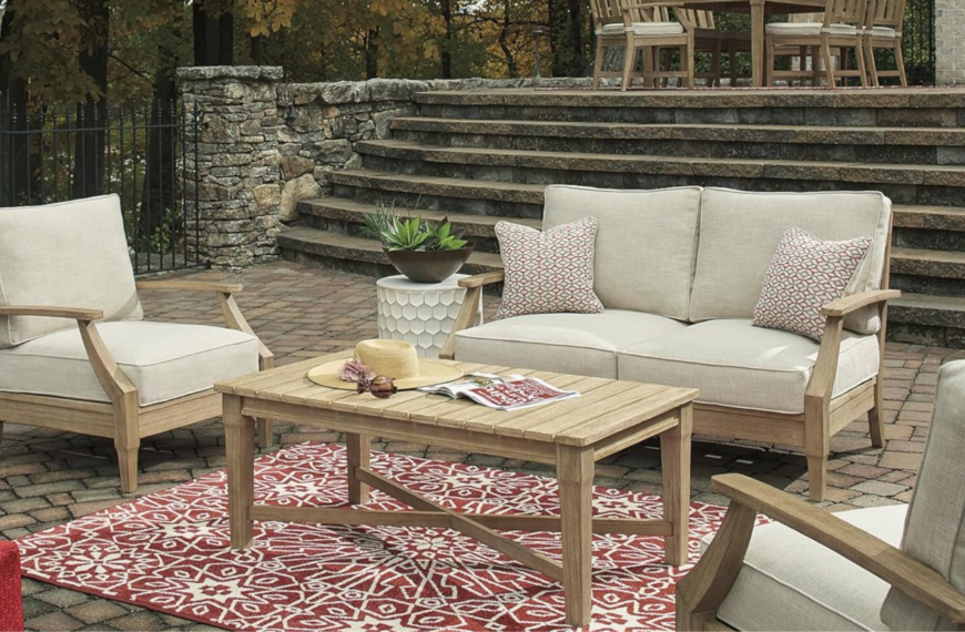 Luxe backyard showing furniture pieces with rug